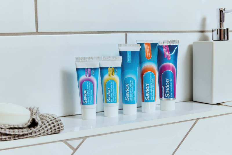 A selection of Savlon products on a bathroom shelf