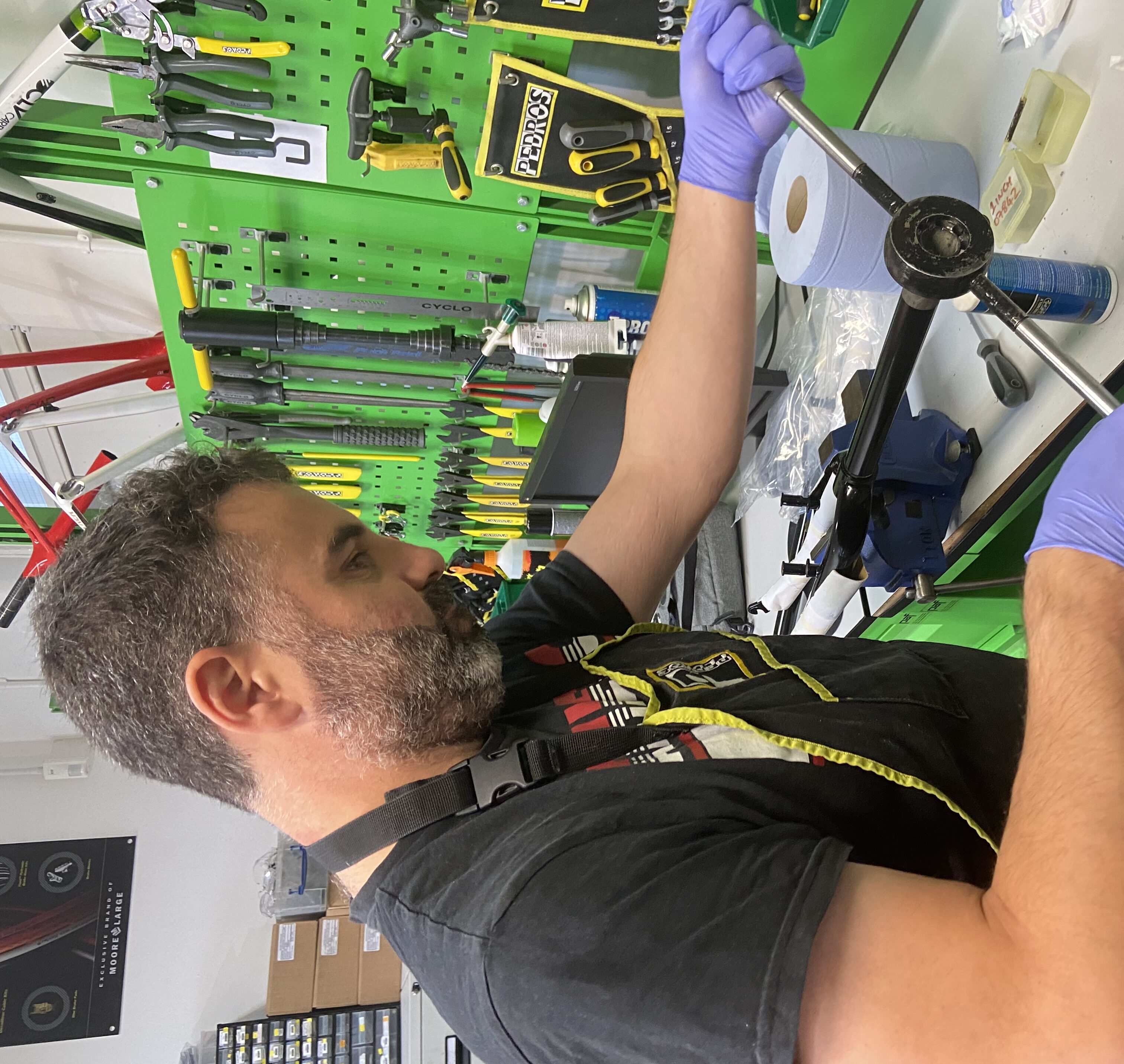 Instructor Jon is working at a vice repairing a cycle part