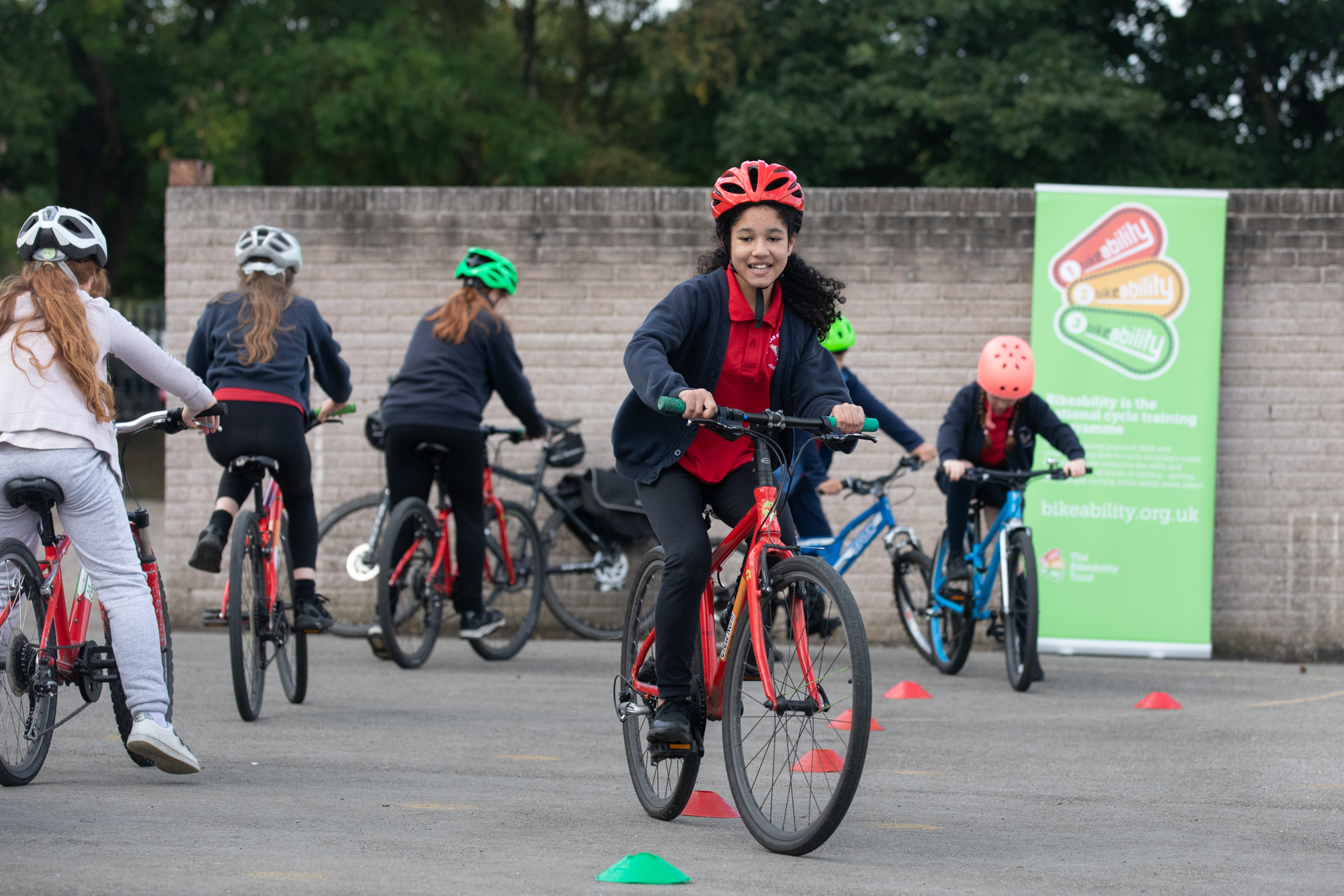 A group of children having a bikeability lesson in a classroom