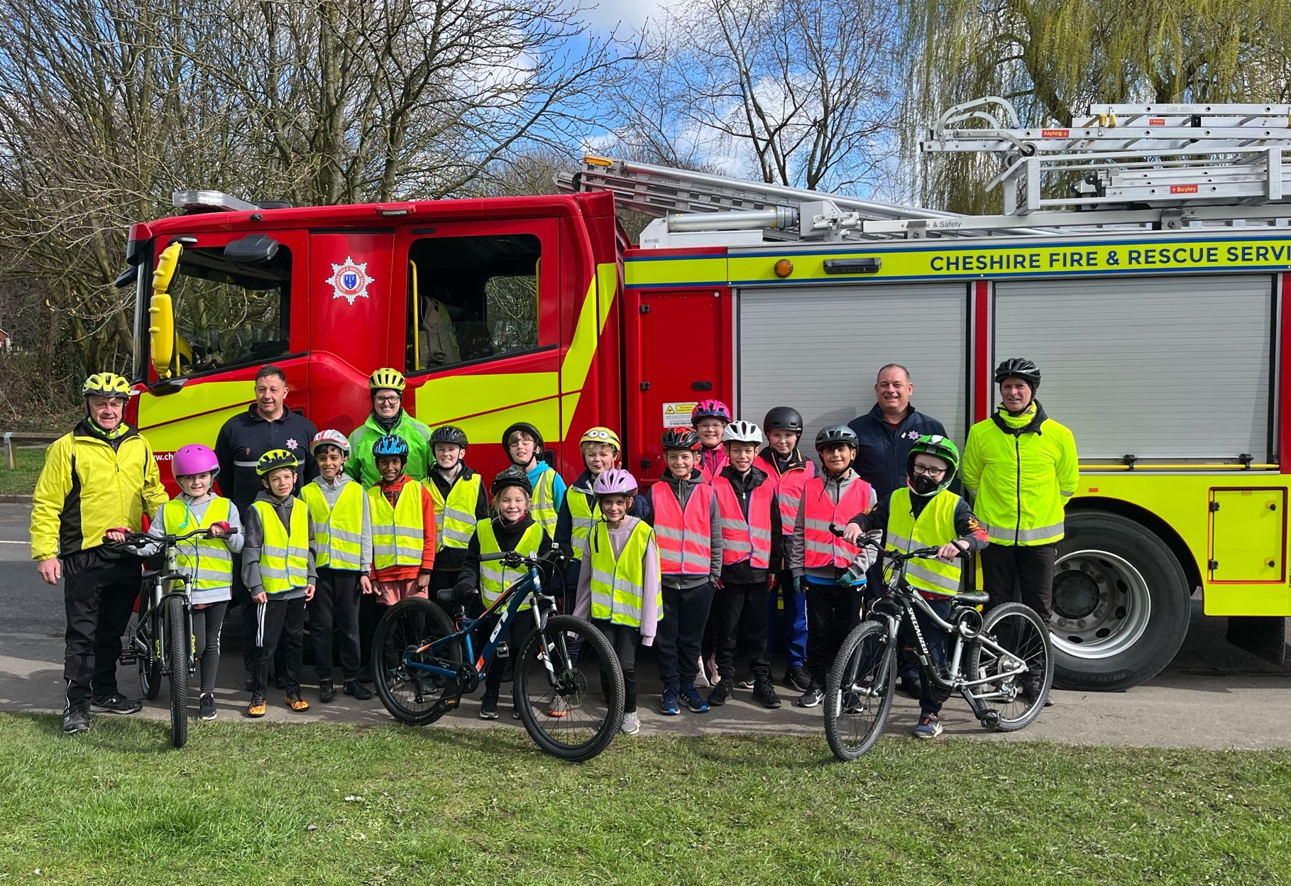 Gareth and some Bikeability riders in front of a fire engine