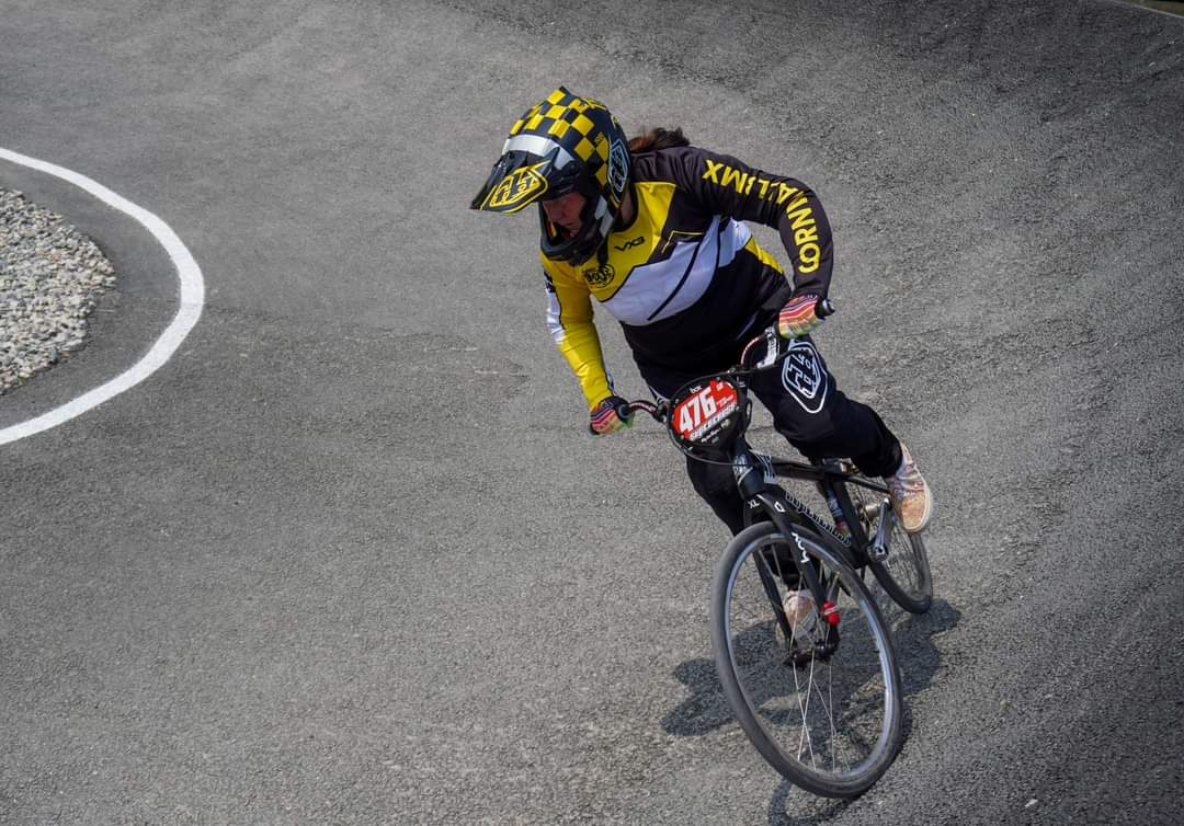 Tracey pn her BMX bike on the track